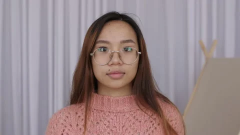 Close-up portrait of happy Middle Eastern girl student posing at trendy modern Stock-Footage 149004727