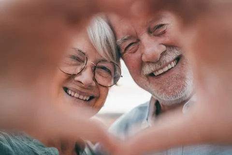 Close up portrait happy sincere middle aged elderly retired family couple m.. Stock Photos