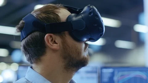 Close-up Portrait of the Industrial Engineer Putting on Virtual Reality Headset Stock-Footage 93690079