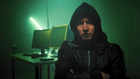 Close up Portrait of IT professional Hacker programmer in black hoody at cyber Stock Footage 114110982