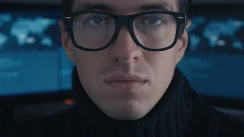 Close up Portrait of IT professional programmer in glasses in cyber security Stock Footage 100685871