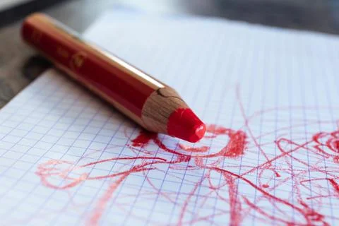 A close up portrait of a large thick red coloring pencil for small children o Stock Photos