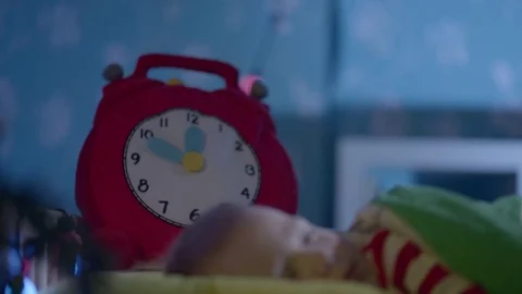 Close up portrait of little pretty boy sleeping in his cot on Christmas night Stock Footage 73930225