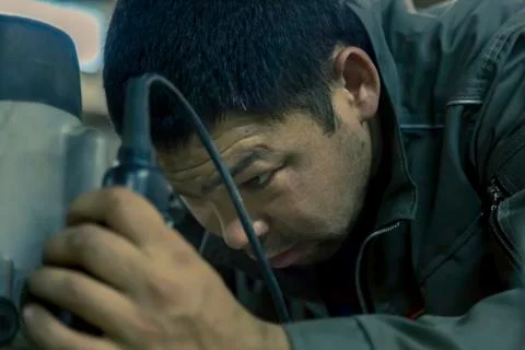 Close-up portrait of locksmith at workplace 스톡 사진