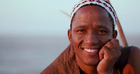 Close-up Portrait of male bushman smiling and looking into the camera Stock Footage