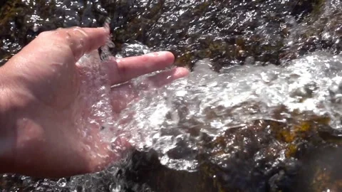 Close up portrait of a man cupping his hands catching water from the Spring Stock Footage 270467062