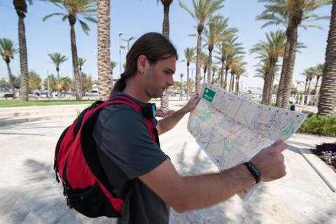 Close portrait of man looking on map in Jerusalem Stock Photos