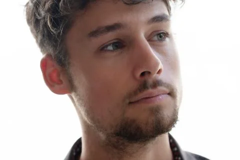 A close-up portrait of a man looking thoughtfully into the distance Stock Photos
