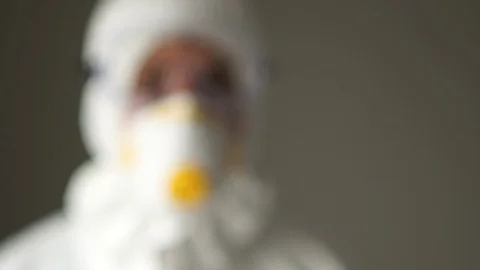 Close portrait of a man in a protective suit. Medical check-up at the airport Stock Footage 126505757