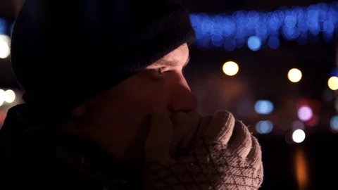 Close up portrait man standing alone outdoors at night on busy city street Stock Footage 83629883