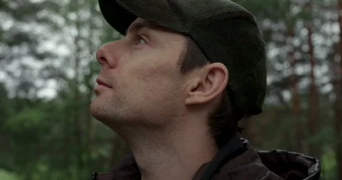 Close up portrait of man taking a deep breath of fresh air in forest Stock Footage 340839948