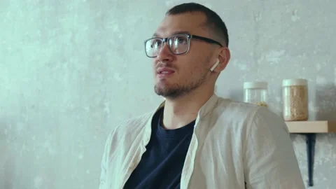 Close-up portrait of a man talking to someone on the phone through wireless Stock Footage 170030680