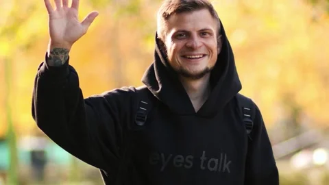 A close-up portrait of a man turning, smiling warmly Stock Footage 287754581