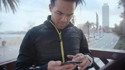 Close up portrait of a man using smartphone looking serious checking important Stock Footage 104490645