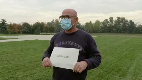 Close Up Portrait of Man While Wears a Medical Mask During Covid-19 Pandemic Stock Footage 141606832