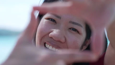 Close up Portrait of Mature Asian Smiling Woman Looking at Camera Stock Footage