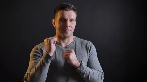 Close-up portrait of middle-aged caucasian man making respecting signs into Stock-Footage 100286616