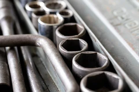A close up portrait of multiple metal sockets of different sizes of a socke.. Stock Photos