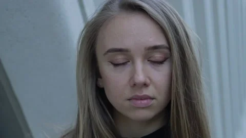 Close-up portrait of nice-looking beautiful young woman looking into camera Stock Footage 150549242