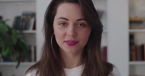 Close up portrait of nice-looking Caucasian woman looking into camera slow Stock Footage 149164155
