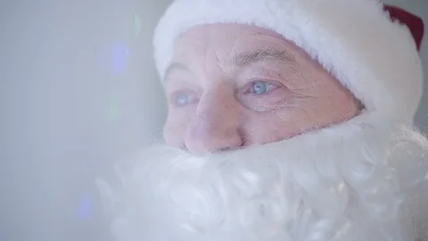 Close-up portrait of the old man with false beard in costume of Santa Claus Stock Footage 120913636