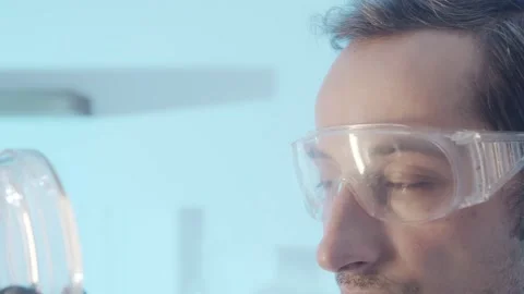 Close-up portrait. Part of the face of a man with brown eyes in protective Stock Footage 171171748