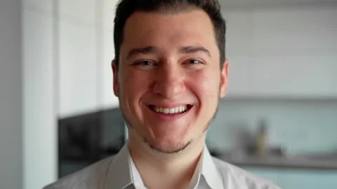 Close up portrait of person looking at camera smiling and laughing Stock Footage 153056749
