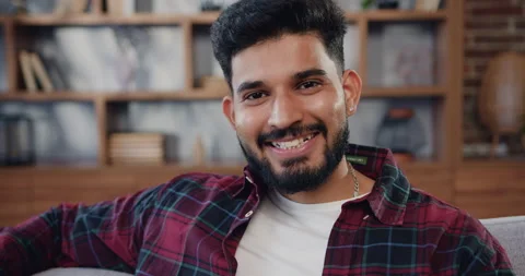 Close-up. Portrait petty man relax on comfort sofa smile staring at camera looks Stock Footage 225540935