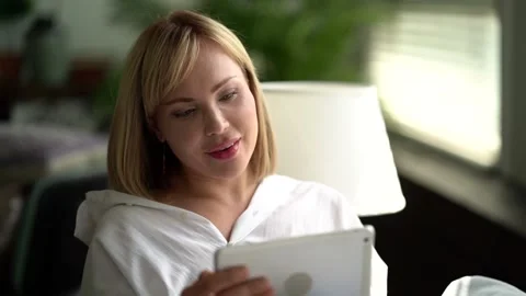A close-up portrait of a pleasant middle-aged woman with short blond hair Видео 134920977