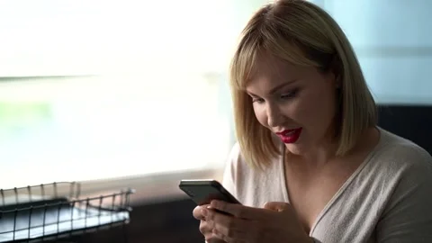 A close-up portrait of a pleasant middle-aged woman with short blond hair Vídeos de archivo 134921045