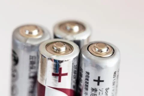 A close up portrait of the plus or positive side of a couple of triple A or A Foto stock