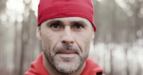 Close up portrait of pro surfer David Langer standing and posing in forest Stock Footage 158693337