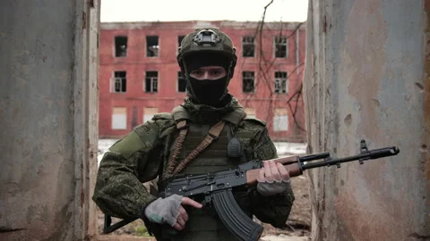 Close Up Portrait of professional fully equipped soldier with Kalashnikov Stock Footage 180213368