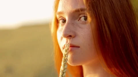 Close-up portrait of a red-haired charming pretty girl with freckles Stock Footage 235032719