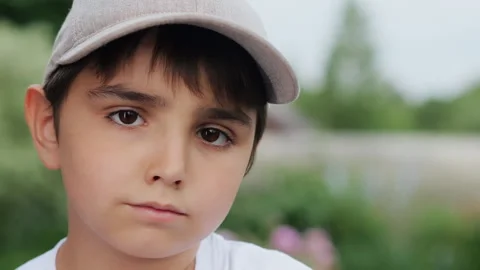 Close-up portrait of a sad boy in a cap. Stock Footage 279287802