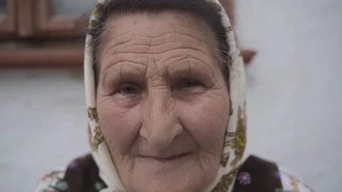 Close up portrait of sad looking senior Caucasian woman looking at camera Stock Footage 298870469