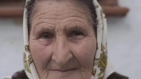 Close up portrait of sad looking senior Caucasian woman looking at camera Stock Footage 298870496