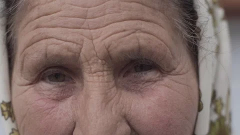 Close up portrait of sad looking senior Caucasian woman looking at camera Video stock 298870559