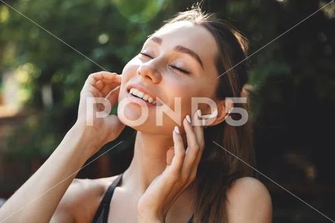 Close up portrait of a satisfied young fitness girl Stock Photos