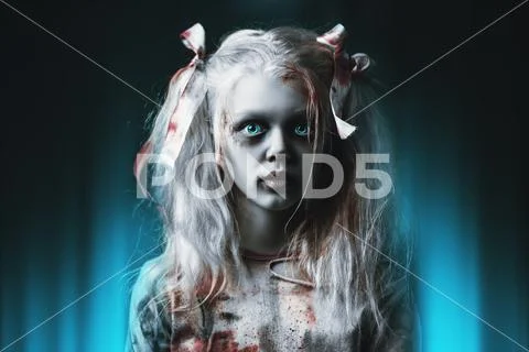 A close-up portrait of a scary girl. Halloween. Horror film. Stock Photos