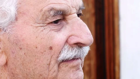 Close-Up Portrait Of senior Man Looking Out Over  스톡 동영상 80697576