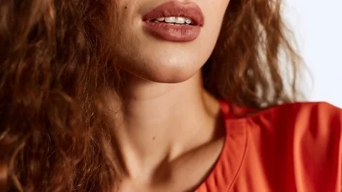 Close-up portrait of sensual lips isolated on white background in studio Stock Footage 82242865