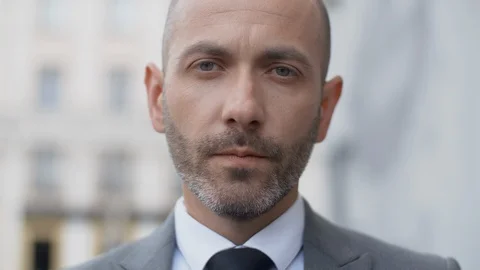 Close up portrait serious business man in suit looking into camera seriously Stock Footage 115531053