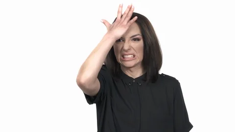 Close-up portrait shot of a woman demonstrating anger or frustration. Model Stock Footage 125182853