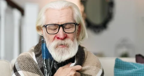 Close up portrait of sick grey-haired Caucasian male pensioner coughing and not Stock Footage 141323797