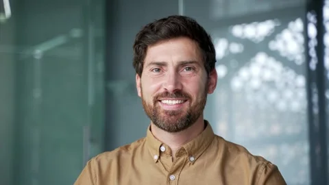 Close-up portrait of a smiling bearded mature businessman in a shirt looking  Stock Footage 342015287