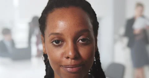 Close up portrait of smiling black young woman looking at camera standing inside Stock-Footage 155491580