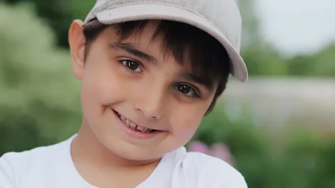 Close-up portrait of a smiling boy in a cap. Stock Footage 279240895