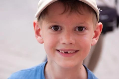 Close-up portrait of a smiling boy without one tooth Fotos Stock