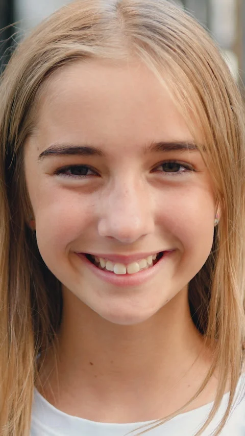 Close up portrait of smiling female elementary school student wearing backpack s Stock Footage 331585318